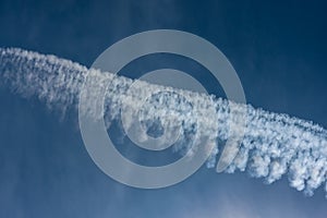 Blue sky with chemtrails or contrails