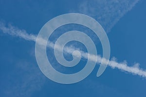 Blue sky with chemtrails or contrails