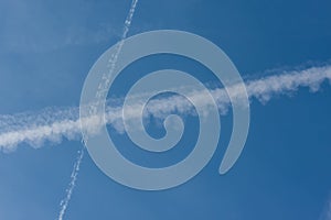 Blue sky with chemtrails or contrails