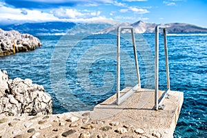 Blue sky and clear water, sea horizon and rocks on island wallpaper