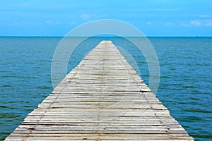 blue sky clear with wooden bridge extending into the sea at resort on holiday,relax time