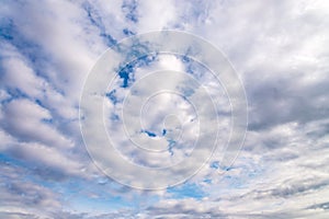 Blue sky with close up white fluffy tiny clouds background and p