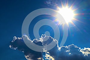 Blue sky and cloud with bright sun star flare background