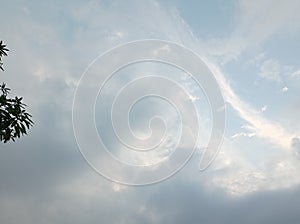 Blue sky and cloud with bright sun star flare background and trees