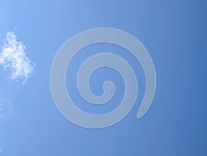 Blue sky with cloud in the corner
