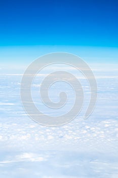 Blue sky and Cloud Top view from airplane window, Nature backgrou