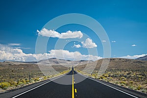 Blue sky and clouds above desert highway