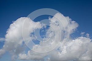 Blue sky with clouds background. Cloudscape. Beautiful soft clouds on blue sky background. Abstract cloud background.