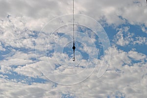 blue sky clouds hook crane