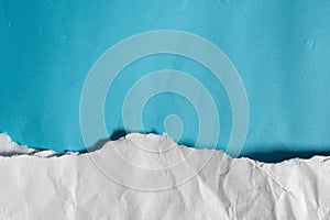 Blue sky and clouds made of blue and white torn paper texture