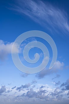 Blue sky with clouds and moon - natural background