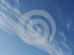 Blue sky with clouds - natural background. White, fluffy clouds in blue sky. Background from clouds.