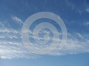 Blue sky with clouds - natural background. White, fluffy clouds in blue sky. Background from clouds.