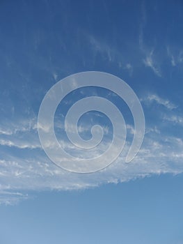 Blue sky with clouds - natural background. White, fluffy clouds in blue sky. Background from clouds.