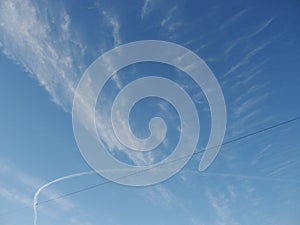 Blue sky with clouds - natural background. White, fluffy clouds in blue sky. Background from clouds.