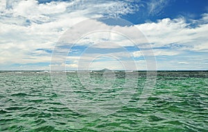 Blue sky with clouds and ocean