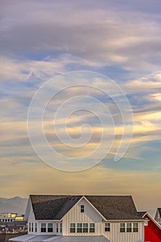 Blue sky with clouds over homes in Daybreak Utah