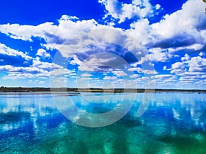Blue sky with clouds over the river