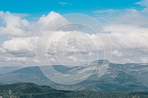 Blue sky and clouds over the rocks, beautiful cloud landscape over mountain