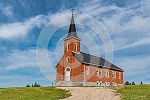 Blue sky and clouds over St. Johns Lutheran Church near Regina, SK