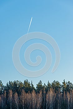 blue sky with clouds and plane trails