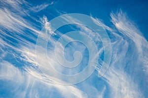 blue sky with clouds and plane trails