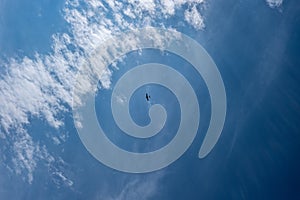 blue sky with clouds and plane trails