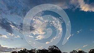 Blue Sky with clouds and silhoette of tropical forest