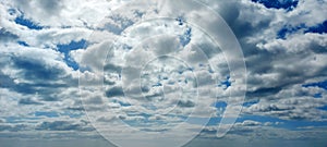 A blue sky with clouds with silver lining.