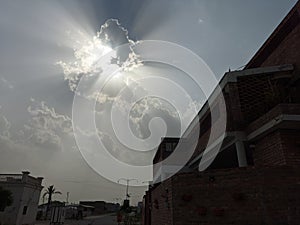 blue sky with clouds and sun beams