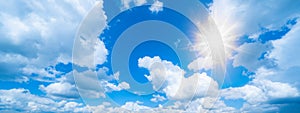 Blue sky, cloudscape background banner panorama , with clouds and sun reflection / sunshine sunbeams