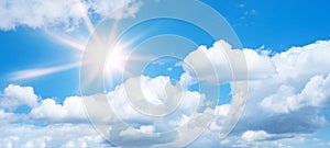 Blue sky, cloudscape background banner panorama , with clouds and sun reflection / sunshine sunbeams - summer weather