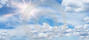 Blue sky, cloudscape background banner panorama , with clouds and sun reflection / sunshine sunbeams - summer weather