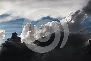 Blue sky with cumulus storm clouds closeup