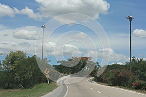 Blue sky and empty curved road