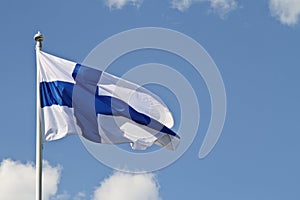 Blue sky and Finland`s flag