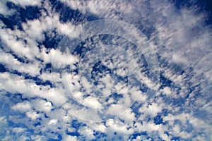 Blue sky with fleecy clouds photo