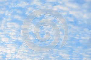 Blue sky with fluffy clouds, close-up background