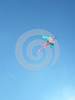 Blue sky and a flying kite and copy spase