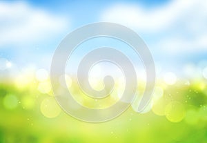 Blue sky green grass blurred bokeh background