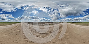 blue sky hdri 360 panorama with awesome clouds on gravel road among fields in spring day in equirectangular full seamless