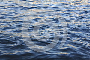 Tracks of the reflecting sun on the water