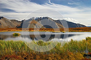 Blue sky, lake and mountains.