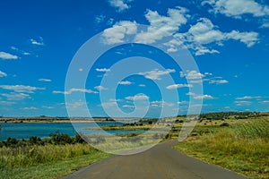 Blue sky landscape of Rietvlei nature reserve with dam in the background in Pretoria