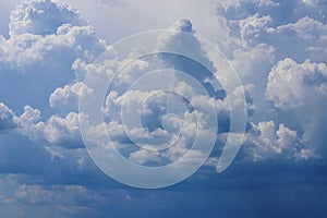 Blue sky with lowering clouds as a background