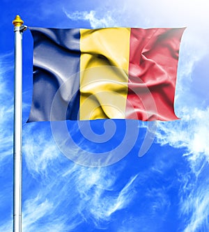 Blue sky and mast with hanged waving flag of Romania