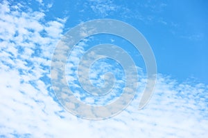 Blue sky with multitude of white clouds