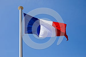 Blue sky and the National Flag of France