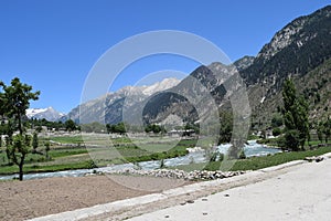 Blue sky with natural stram of water and montains in the kumrat valley kp pakistan