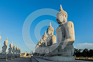 Blue sky over buddha statues